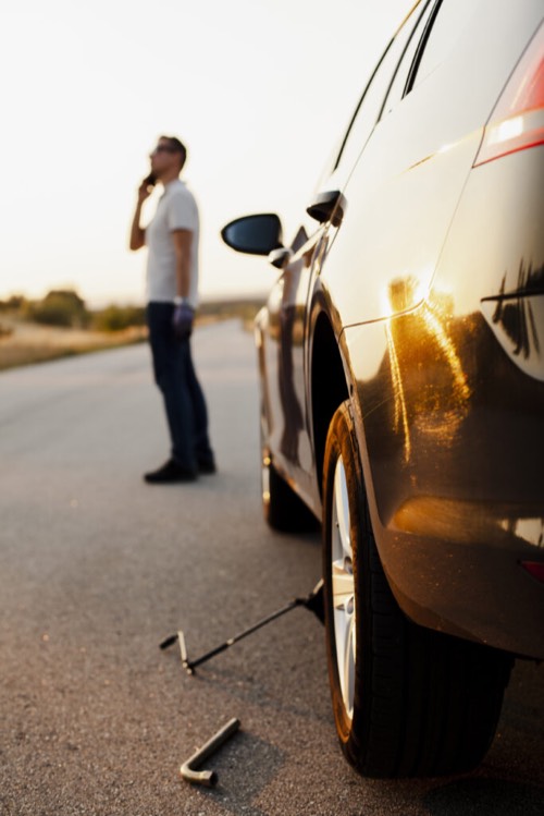 Man talking on phone about car problem